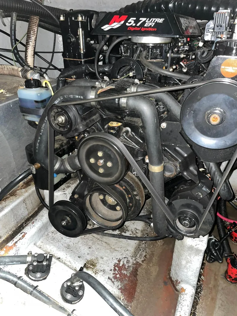 Slide: The Image of Engine of a 2000 Crownline 290 CR boat, featuring a 5.7L V8 motor. - 26