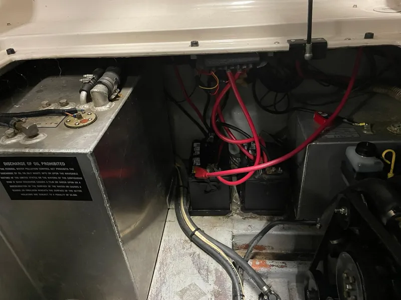 Slide: The Image of Engine compartment of 2000 Crownline 290 CR with batteries and wiring. - 28