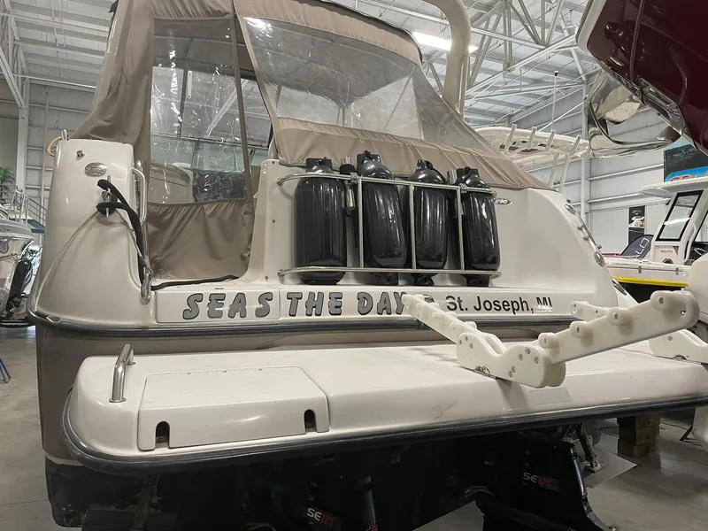 Slide: The Image of Crownline 290 CR 2000 boat named "Seas the Day" in storage facility. - 9