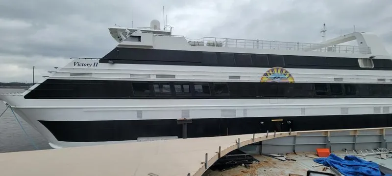 The Image of Custom Victory 11 yacht, 1981 model, docked on a cloudy day. - 0