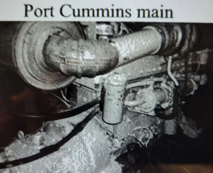 Slide: The Image of Close-up of a 1985 Custom engine labeled "Port Cummins main." - 18