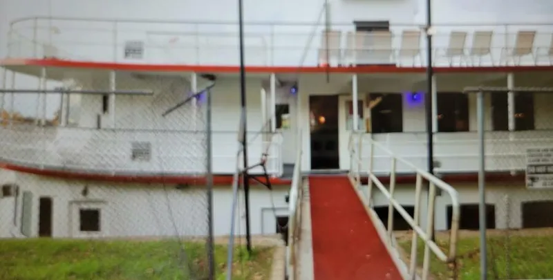 Slide: The Image of 1985 custom dinner excursion passenger boat with red carpeted entrance and upper deck seating. - 2