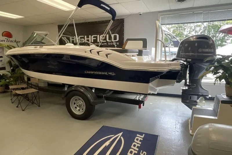 Slide: The Image of 2024 Chaparral 19 SSi OB boat with Yamaha outboard motor in showroom. - 2