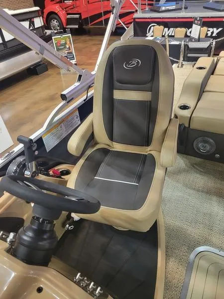 Slide: The Image of 2025 Barletta C24U boat interior with captain's chair and steering wheel. - 14