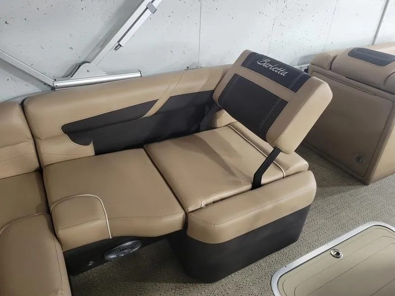 Slide: The Image of 2025 Barletta C24U boat interior with tan and black seating. - 15