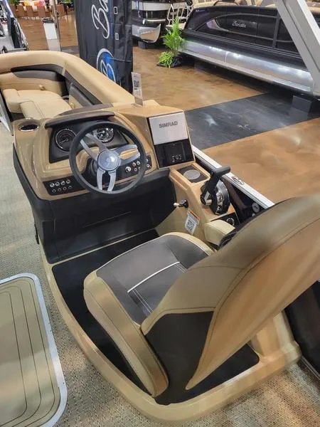 Slide: The Image of 2025 Barletta C24U boat interior with modern steering and control panel. - 16