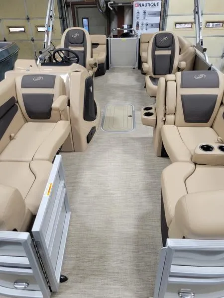 Slide: The Image of 2025 Barletta C24U pontoon boat interior with luxurious beige seating and modern design. - 17