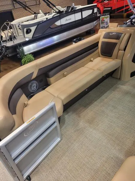 Slide: The Image of 2025 Barletta C24U pontoon boat interior with beige seating and modern design. - 18