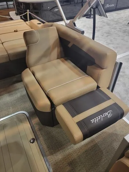 Slide: The Image of Barletta C24U 2025 boat seat, tan and black upholstery, luxurious design. - 27