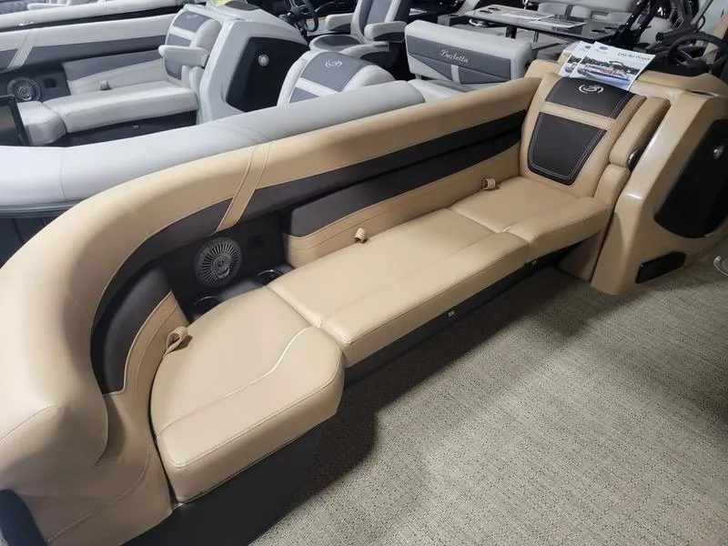 Slide: The Image of 2025 Barletta C24U pontoon boat interior with beige seating and modern design. - 3
