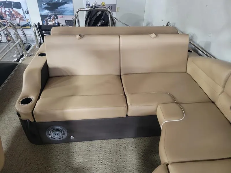 Slide: The Image of Barletta C24U 2025 boat interior with beige seating and cup holders. - 30