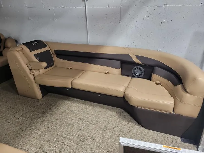 Slide: The Image of 2025 Barletta C24U boat interior with beige and brown seating. - 31