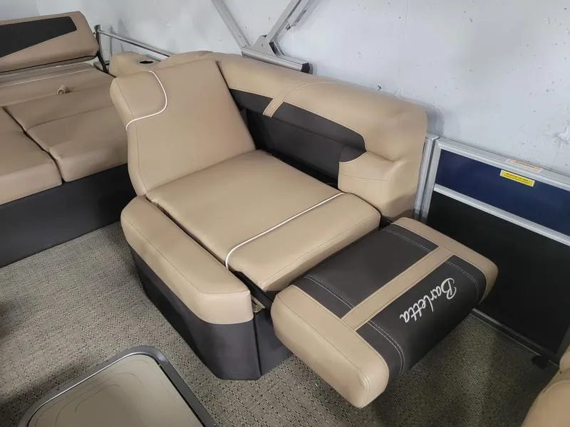 Slide: The Image of 2025 Barletta C24U boat interior with beige and brown seating. - 8