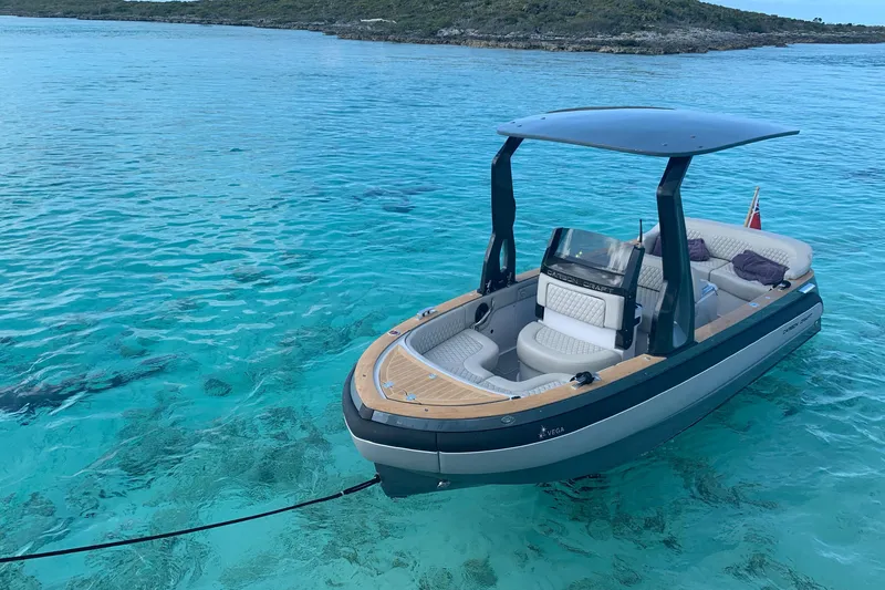 Slide: The Image of Carbon Craft CC 160 boat, 2016 model, floating on clear turquoise water. - 2