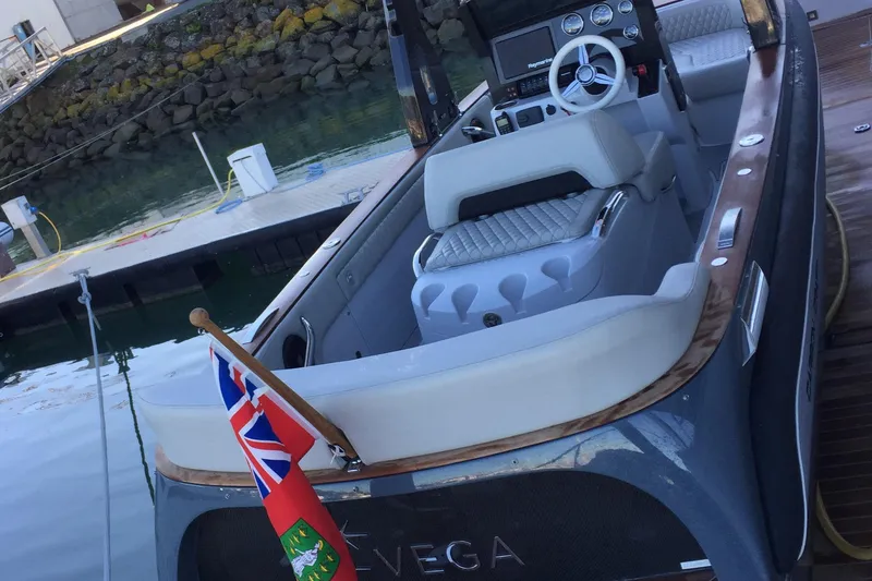 Slide: The Image of Luxury Carbon Craft CC 160 boat, 2016 model, docked with flag and elegant interior. - 7