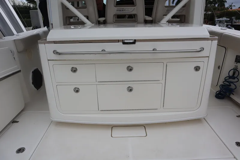Slide: The Image of 2022 Boston Whaler 380 Outrage boat interior storage compartments. - 13