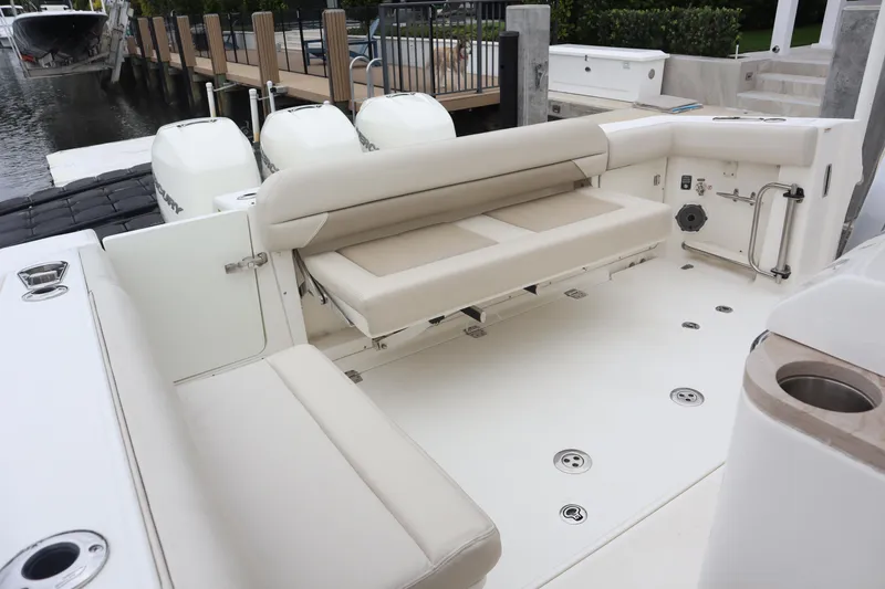 Slide: The Image of Boston Whaler 380 Outrage 2022 boat interior with seating and outboard motors. - 15