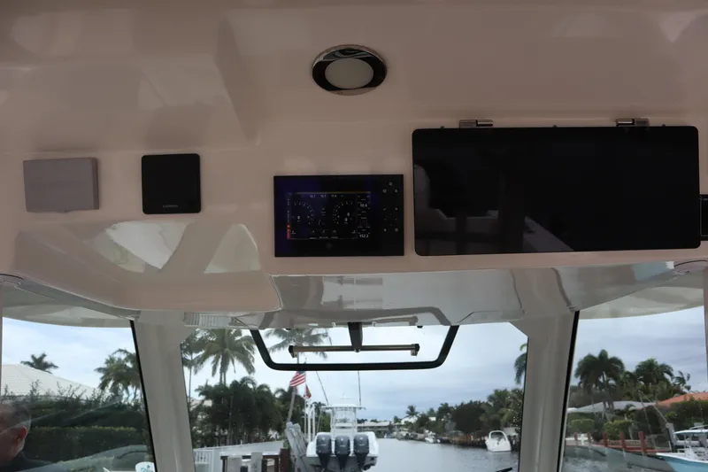 Slide: The Image of Interior view of 2022 Boston Whaler 380 Outrage boat with navigation equipment. - 21