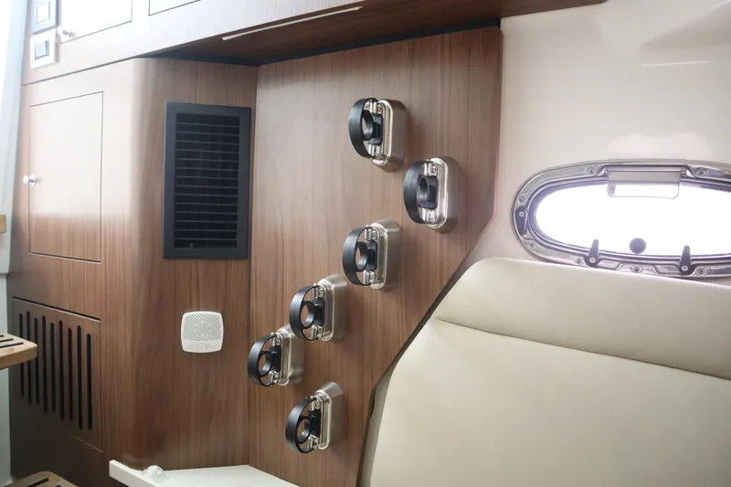 Slide: The Image of Interior of 2022 Boston Whaler 380 Outrage, featuring wood paneling and modern design elements. - 24