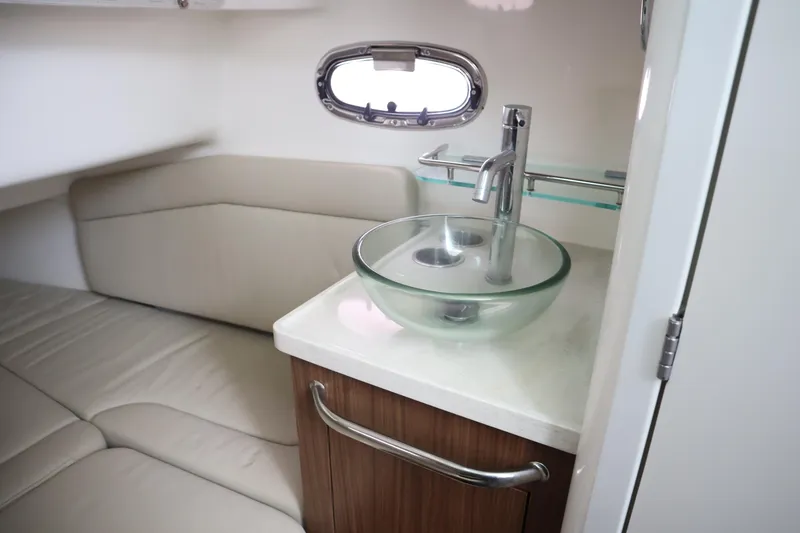Slide: The Image of 2022 Boston Whaler 380 Outrage interior with modern sink and seating area. - 25