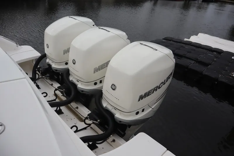 Slide: The Image of Triple Mercury outboard engines on a 2022 Boston Whaler 380 Outrage boat. - 9
