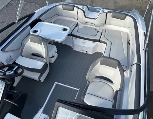 Slide: The Image of 2020 Yamaha Boats SX190 interior with seating and table setup. - 11