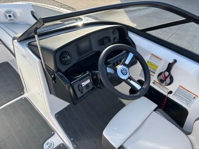 Slide: The Image of 2020 Yamaha SX190 boat cockpit with steering wheel and dashboard controls. - 14