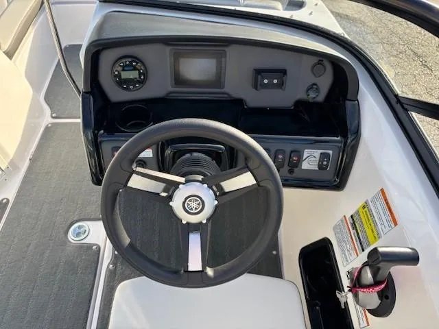 Slide: The Image of 2020 Yamaha Boats SX190 dashboard and steering wheel, featuring modern controls and instrumentation. - 15