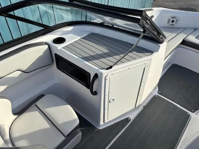 Slide: The Image of 2020 Yamaha Boats SX190 interior with seating and storage compartments. - 16