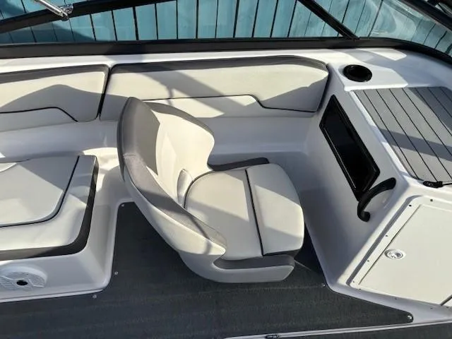 Slide: The Image of 2020 Yamaha Boats SX190 interior with white seating and sleek design. - 18