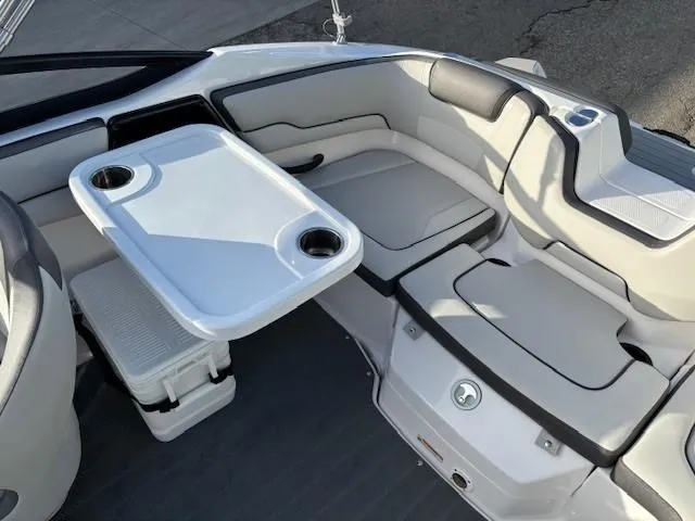 Slide: The Image of 2020 Yamaha SX190 boat interior with seating and table setup. - 20