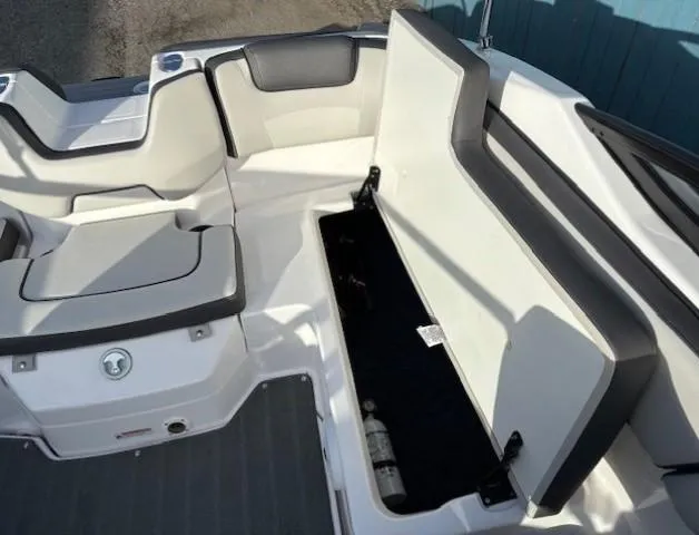 Slide: The Image of 2020 Yamaha SX190 boat interior with open storage compartment. - 23