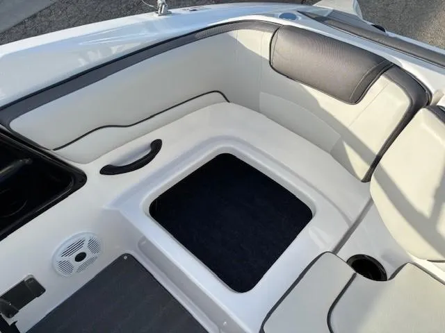 Slide: The Image of 2020 Yamaha Boats SX190 interior seating area with white and black upholstery. - 24