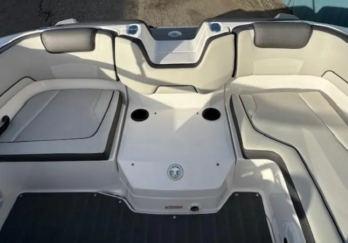 Slide: The Image of 2020 Yamaha Boats SX190 interior seating area with cup holders. - 26