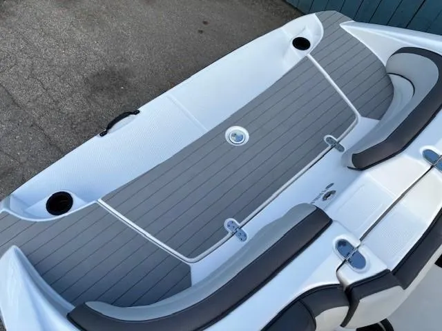 Slide: The Image of 2020 Yamaha Boats SX190 deck with gray seating and cup holders. - 28