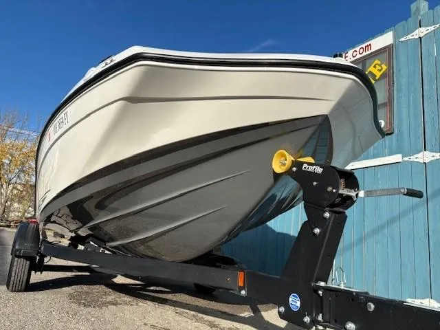 Slide: The Image of 2020 Yamaha SX190 boat on trailer, parked outdoors under clear blue sky. - 3
