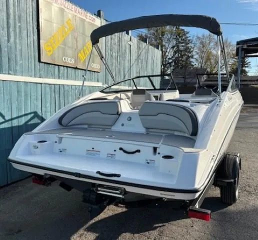 Slide: The Image of 2020 Yamaha Boats SX190, white, parked outdoors with canopy up. - 4