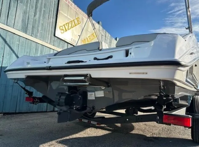 Slide: The Image of 2020 Yamaha SX190 boat on trailer, rear view, parked outdoors. - 5