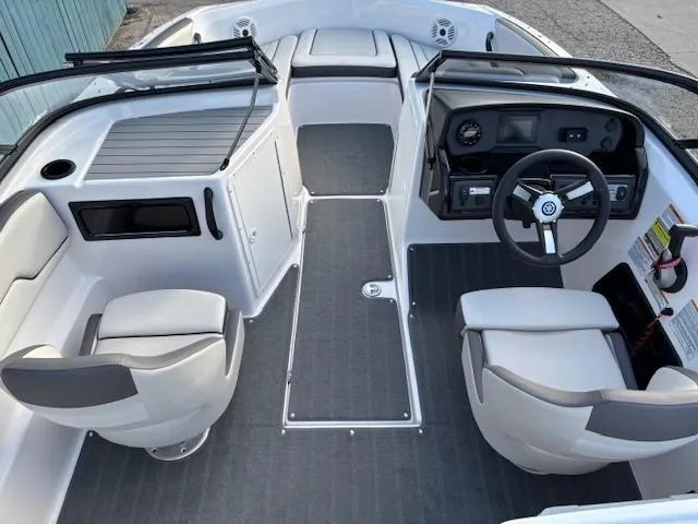 Slide: The Image of 2020 Yamaha Boats SX190 interior with dual seats and sleek dashboard design. - 9
