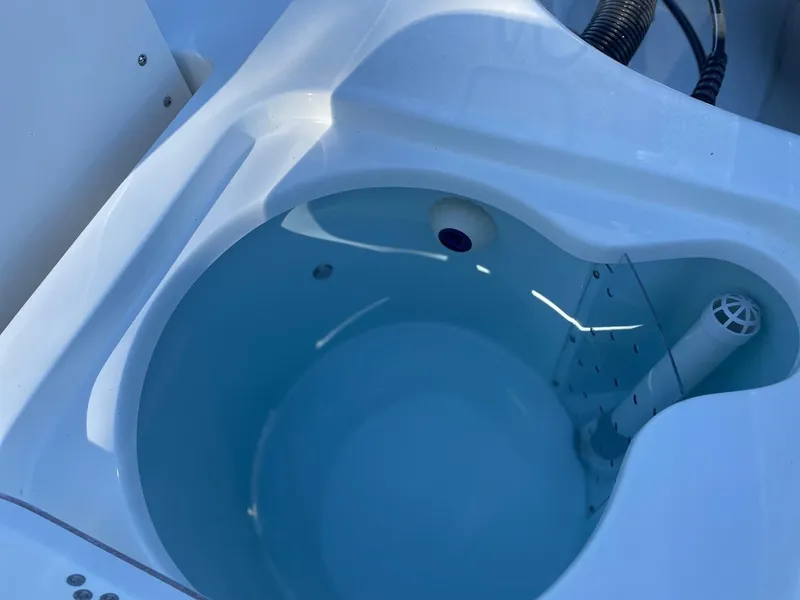 Slide: The Image of Livewell in 2025 Sea Pro 210 DLX boat, filled with water. - 15