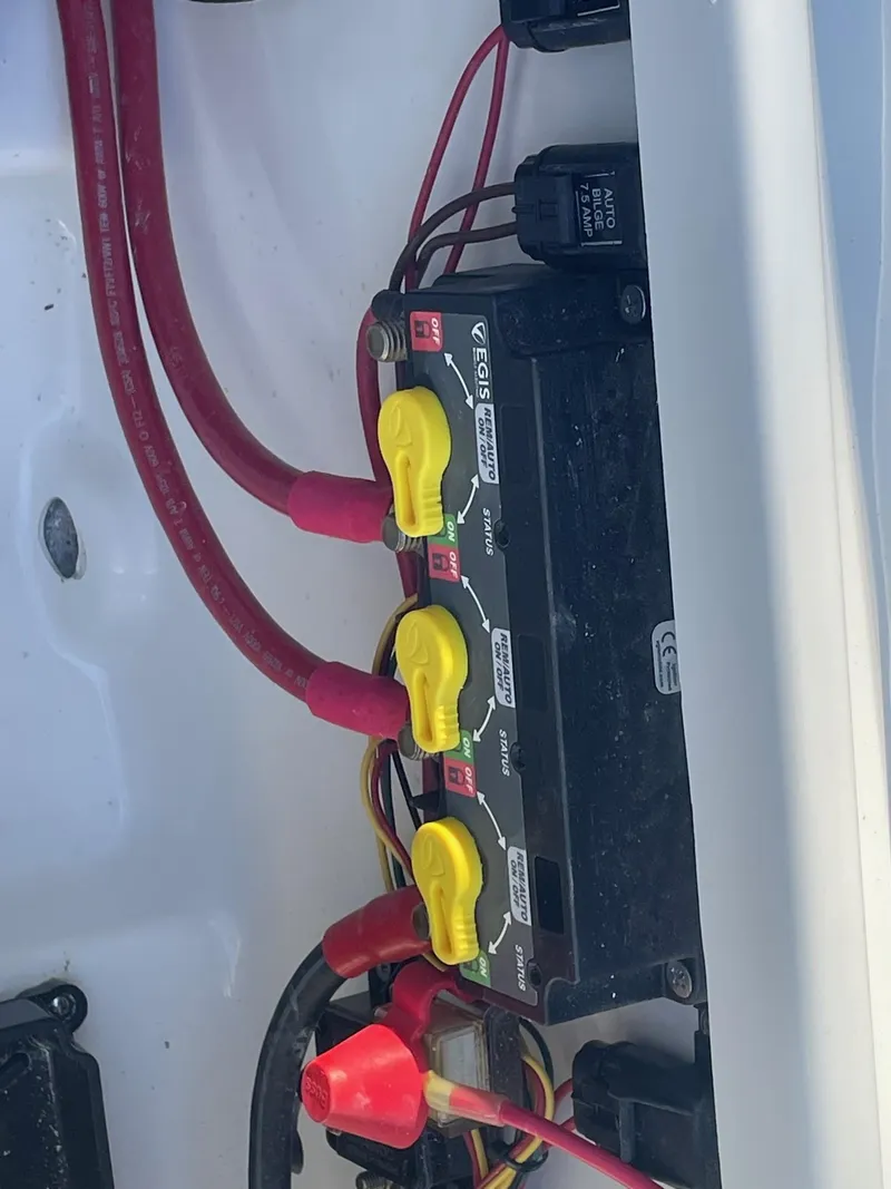 Slide: The Image of Electrical panel with yellow switches on a 2025 Sea Pro 210 DLX boat. - 19