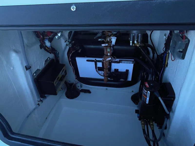 Slide: The Image of 2025 Sea Pro 210 DLX boat interior wiring and components. - 20