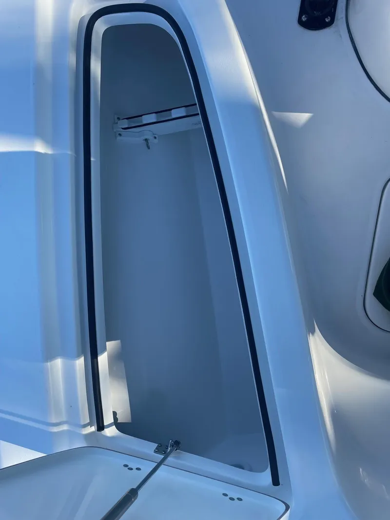 Slide: The Image of Open storage compartment on 2025 Sea Pro 210 DLX boat. - 6