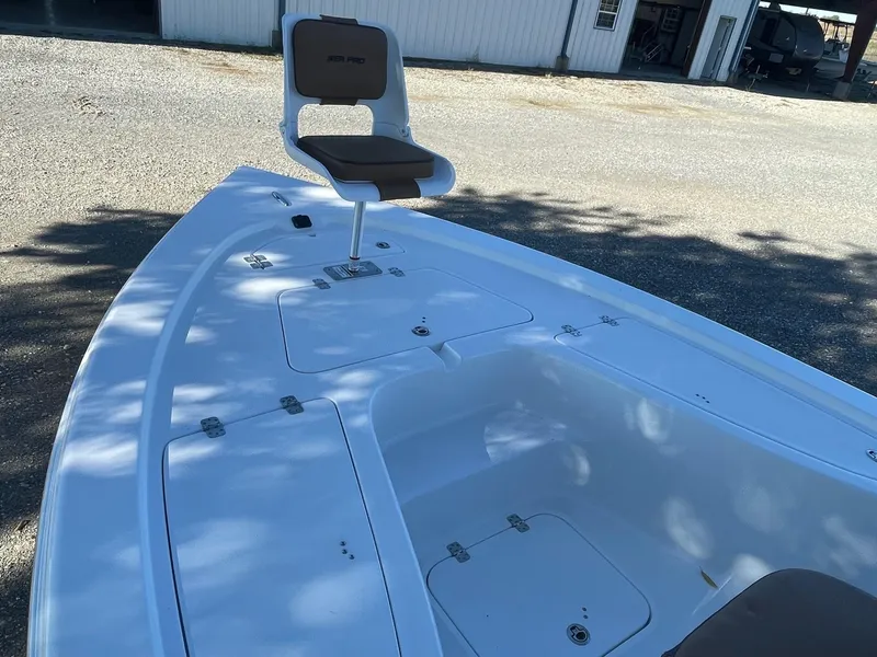 Slide: The Image of 2025 Sea Pro 210 DLX boat deck with seating and storage compartments. - 7