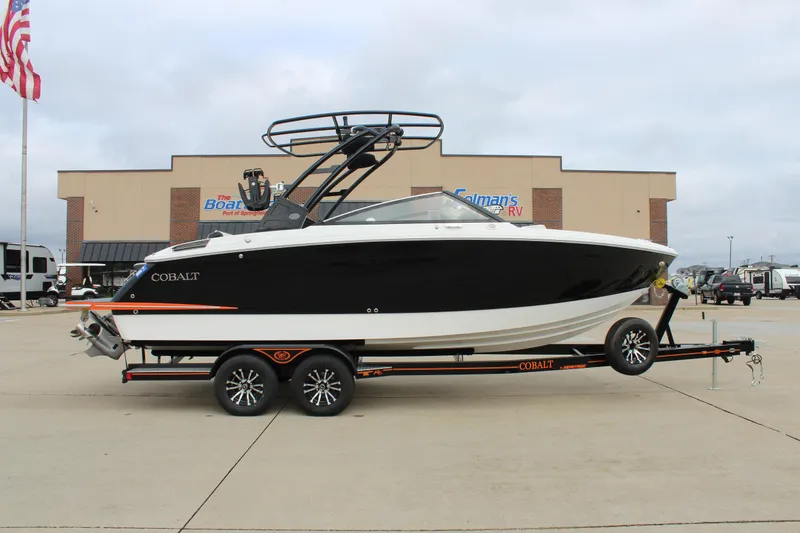The Image of 2024 Cobalt R6 boat on trailer, parked outside dealership. - 0
