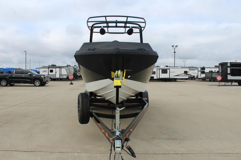 Slide: The Image of 2024 Cobalt R6 boat on trailer in parking lot, surrounded by RVs and vehicles. - 11