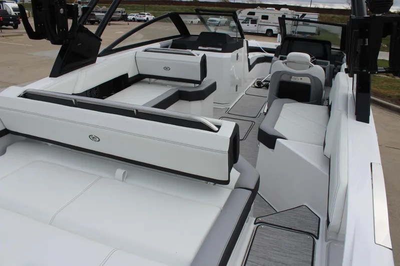 Slide: The Image of 2024 Cobalt R6 boat interior with luxurious white seating and modern design. - 16