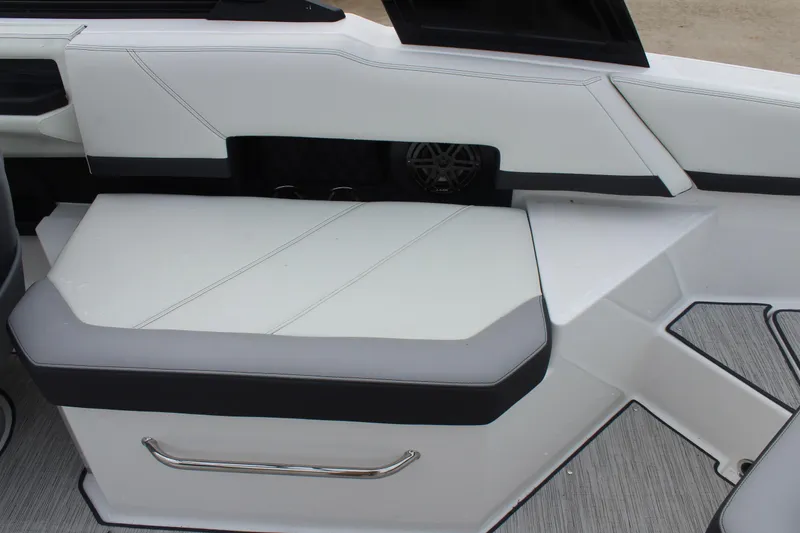 Slide: The Image of 2024 Cobalt R6 boat interior with white and gray seating and sleek design. - 22