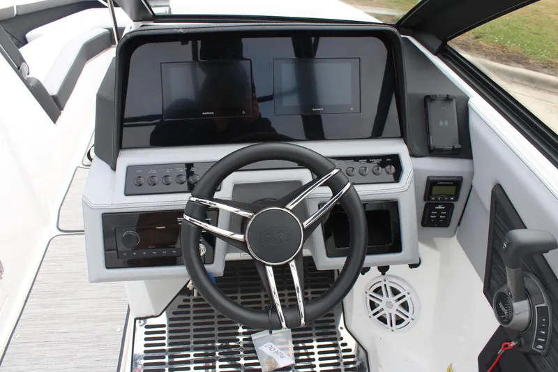 Slide: The Image of 2024 Cobalt R6 boat dashboard with steering wheel and digital displays. - 23
