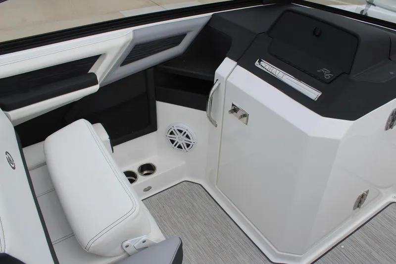Slide: The Image of 2024 Cobalt R6 boat interior with white seating and modern dashboard design. - 25